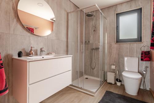 a bathroom with a shower and a sink and a toilet at Felicidade in Mondim de Basto