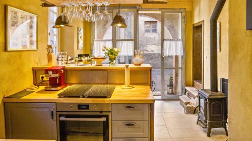 a kitchen with a counter with a mixer on it at Ferienwohnungen Altes Rathaus in Vogtsburg