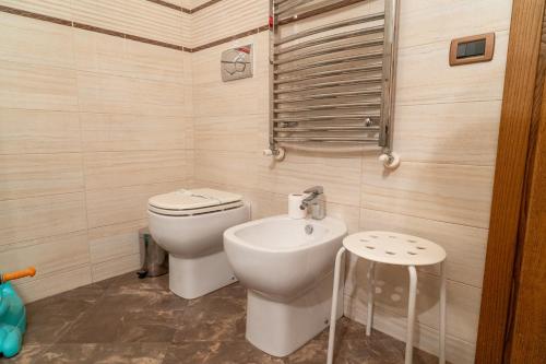 a small bathroom with a toilet and a sink at Barsotti House - Lucca in Lucca