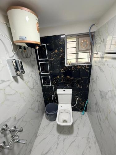 a bathroom with a toilet and a sink at Connect Backpackers Hostel in Chennai
