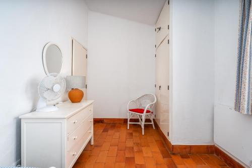 a dressing room with a mirror and a dresser at Ocean Villa Algarve in Alvor
