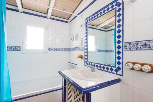 a bathroom with a sink and a mirror at Cala Serena Beach 1 in Felanitx