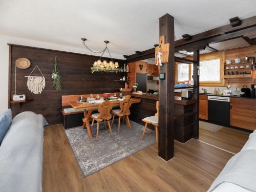 a kitchen and dining room with a table and chairs at Apartment SnowKaya Grindelwald by Interhome in Grindelwald