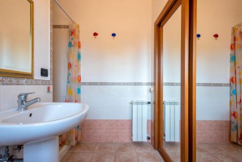 a bathroom with a sink and a shower at Villafiorita in Alghero