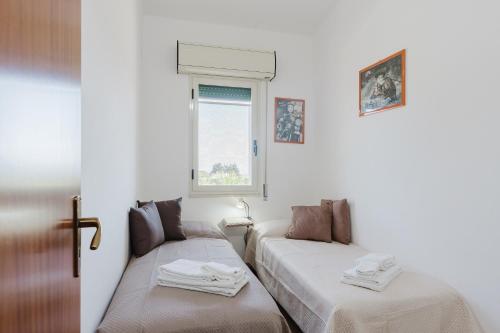 a room with two beds and a window at Casa Margiulu’ - Partanna in Partanna