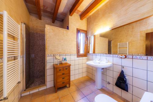 a bathroom with a sink and a mirror at Finca Mirador Capdepera in Capdepera
