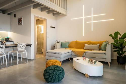 a living room with a couch and a table at Dias Guest House in Rethymno