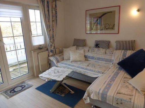a living room with two beds and a couch at Erholung-pur in Hennstedt