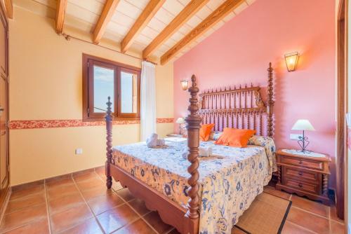 a bedroom with a bed and a window at Can Pedro - Sa Torre Nova in Son Carrió