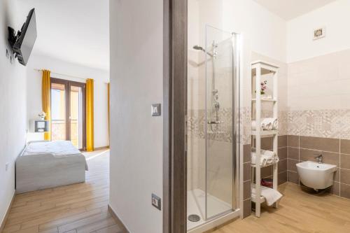 a bathroom with a shower and a sink at Affittacamere Da Riccardo in Jerzu
