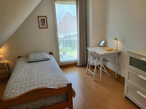 Postel nebo postele na pokoji v ubytování Les 3 Mésanges