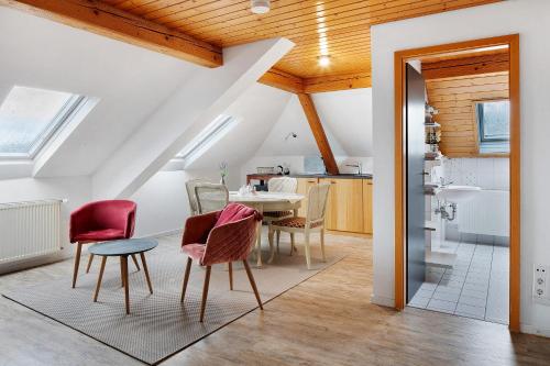 a kitchen and dining room with a table and chairs at Landhaus Trautwein in Vogtsburg