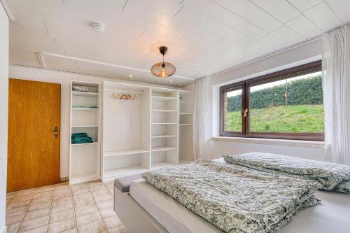 a bedroom with two beds and a window at Am Linnert in Haltern