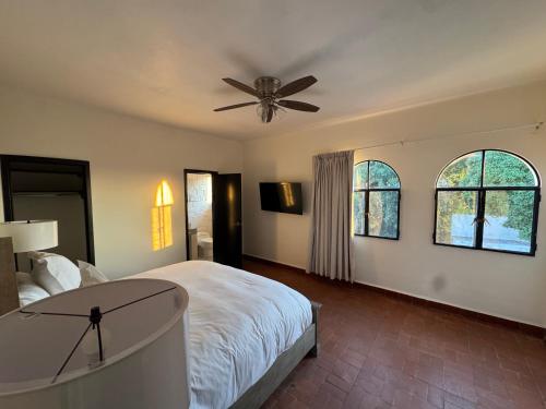 a bedroom with a bed and a ceiling fan at Villa Marines Cuernavaca in Cuernavaca