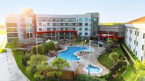 an aerial view of a hotel with a swimming pool at Choctaw Casino & Resort Grant, Trademark Coll by Wyndham in Grant