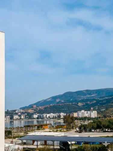 a view of a city with a river and buildings at Radhima Beach Apartments in Vlorë