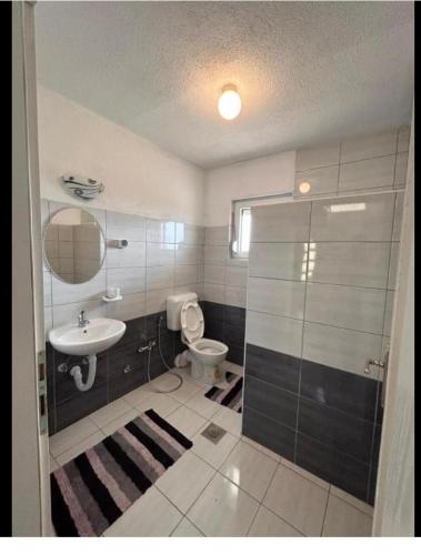 a bathroom with a toilet and a sink and a shower at Villa Ilijas 3 bedrooms in Ilijaš