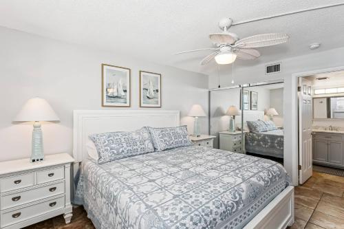 a bedroom with a bed and a ceiling fan at Santa Rosa Dunes 923 in Pensacola Beach