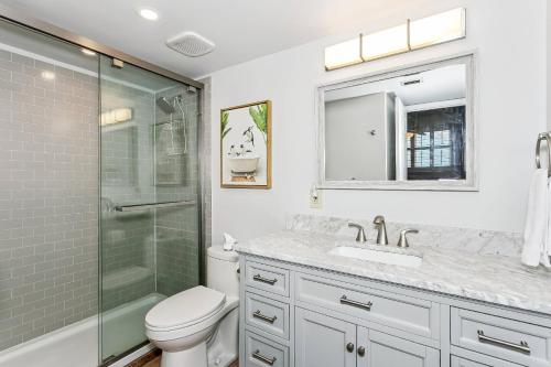 a bathroom with a shower and a toilet and a sink at Santa Rosa Dunes 923 in Pensacola Beach
