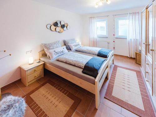 a bedroom with a bed in a room at Ferienwohnung Storchenaue in Wächtersbach