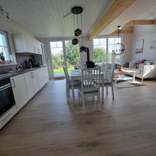 a kitchen and dining room with a table and chairs at Haus Abendsonne in Wandlitz