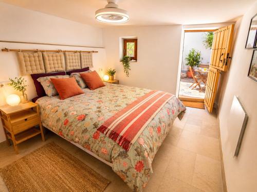 a bedroom with a large bed in a room at El Jardin Secreto in Oria