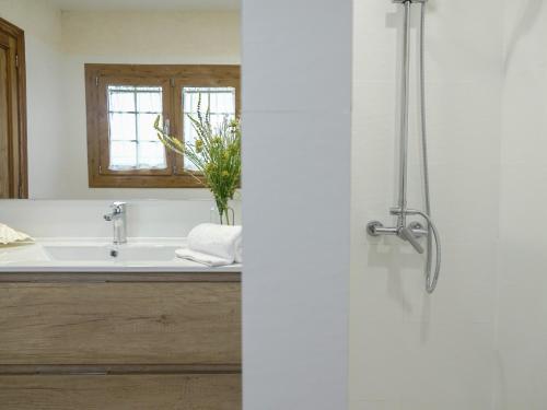 a bathroom with a sink and a shower at Vinyes Can Grau in Sencelles