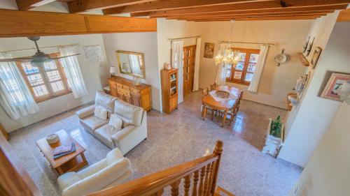 an overhead view of a living room with white furniture at Vinyes Can Grau in Sencelles