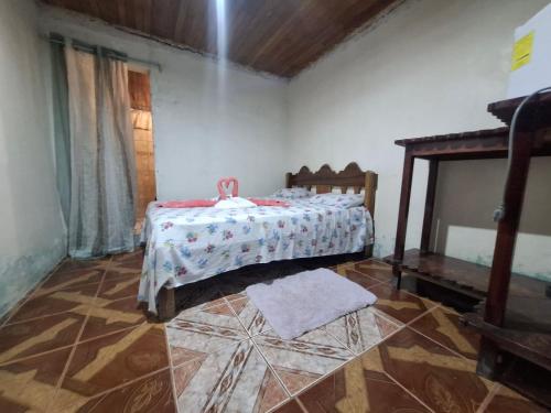 a bedroom with a bed in a room at Hotel Lucy in Montezuma