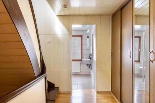 a hallway leading to a bathroom with a sink at Ferienwohnung Hennen in Witzenhausen