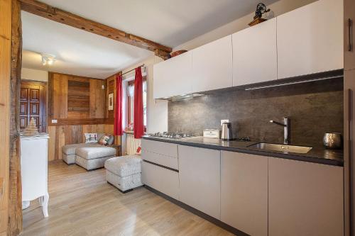 a kitchen with a sink and a counter top at Appartamento Pila Vacanze in Gressan