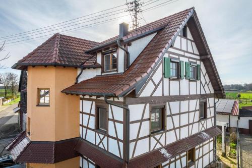 an old house with a brown roof at Haus48 in Neuried