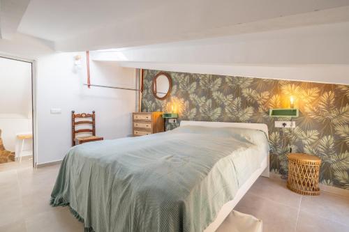 a bedroom with a large bed in a room at Casa Sol y Luna in Artá