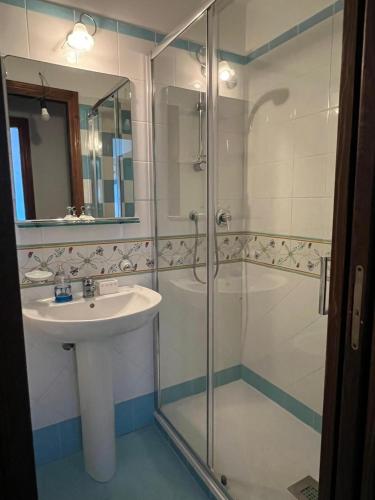 a bathroom with a sink and a shower at Villa Edith in Parghelia