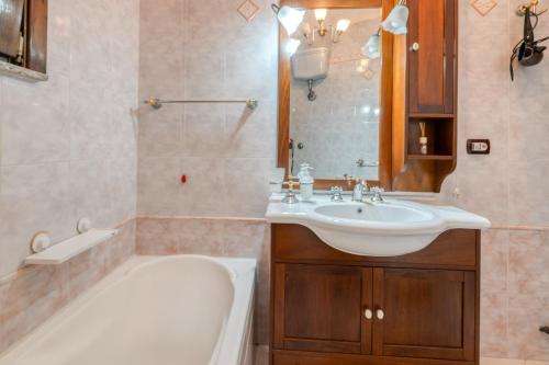 a bathroom with a tub and a sink and a bath tub at Meraviglie Salentine - Lecce in Lequile