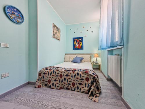 a bedroom with a bed in a blue room at Villa Galatea Exclusive in Capoliveri