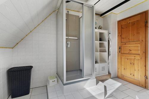 a bathroom with a shower with a glass door at Haus Kornfeld in Kehl am Rhein