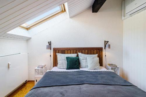a bedroom with a large bed in a attic at Stadt-Loft mit Dachterrasse in Nordhausen