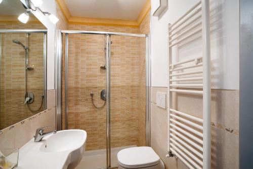 a bathroom with a shower and a toilet and a sink at Conchiglia, borgo dei pescatori in Cervo