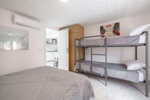 a bedroom with two bunk beds in it at La Fabriqueta Studio in Ríudecañas