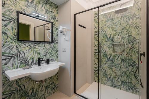 a bathroom with a sink and a shower at Dimora Borgo Antico Lucia in Ascea