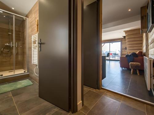 a hallway with a door leading to a living room at Gite Le Mazot in Albiez-Montrond