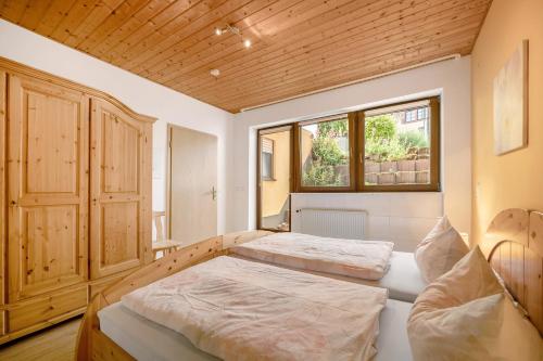 a bedroom with two beds and a window at Casa Mia in Bad Dürkheim