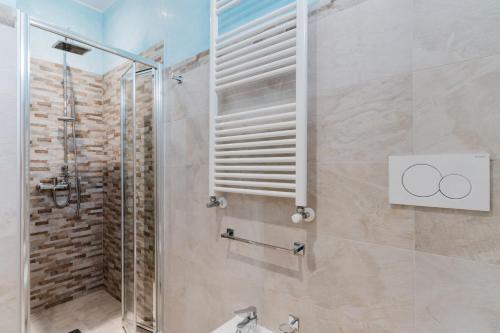 a bathroom with a shower with a glass door at Casa Vacanza Susanna in Otranto