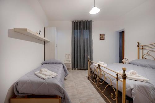 a bedroom with two twin beds next to each other at Oasi Torre Di Mastro, Conversano in Conversano