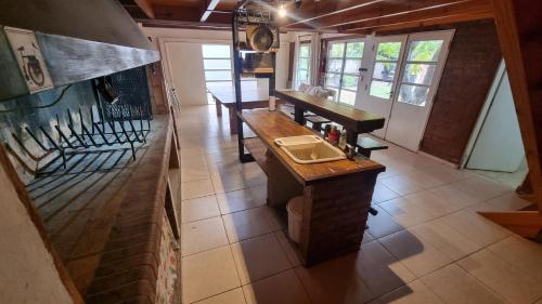 a bathroom with a sink and a counter in a room at Casa quincho en plottier in Plottier