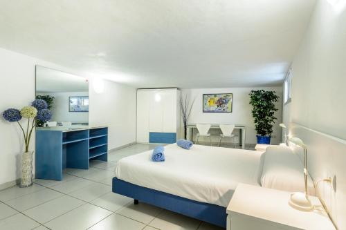 a bedroom with a large bed and a mirror at Can Lluc in Nuestra Señora de Jesus