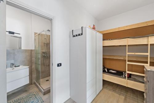 a bathroom with a shower and a toilet and a sink at Villa Matteo in Porto Columbu - Perdʼe Sali