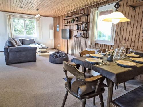 a living room with a table and a couch at Apartment Crap Grisch by Interhome in Ruschein