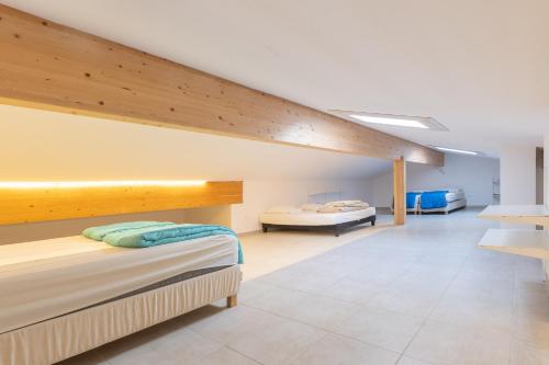 a room with two beds and a staircase at Villa Luminières 2 in Sallelles